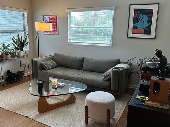 Living room with furniture oriented to to have open floor plan