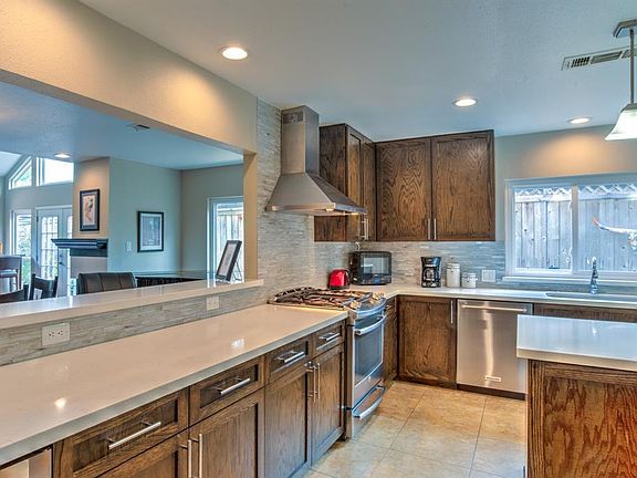 Beautiful state of the art kitchen with gas stove, stainless appliances and large island.