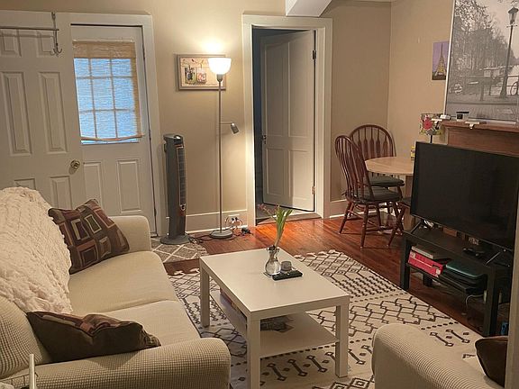 Den looking towards 2nd bedroom, door to the backyard, and Laundry shed.