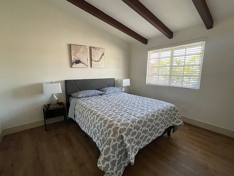 Master bedroom with a queen mattress.