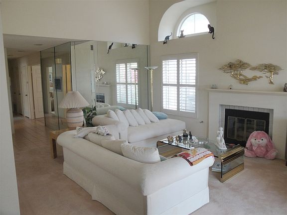 ANOTHER VIEW OF THE LIVING ROOM WITH THE FIREPLACE