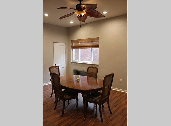 Dining room with new recessed lighting, fan, and flooring