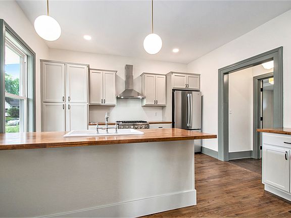 High end kitchen with pro-style range and bar seating.