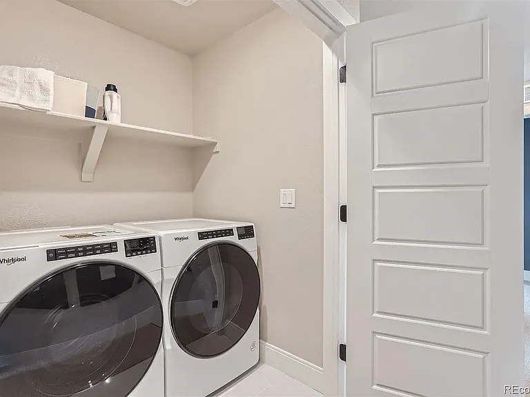 Washer dryer room off the hallway on the second floor