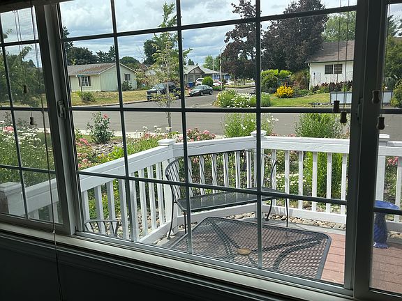 Front deck view from living room window (2023).