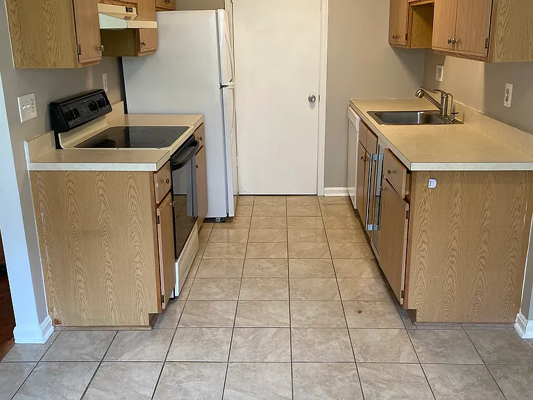 Kitchen. Washer and Dryer behind door.