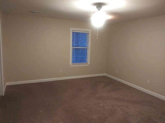 Master bedroom with walk-in closet and linen closet