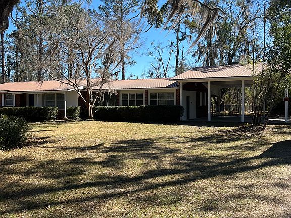Front view showing spacious carport