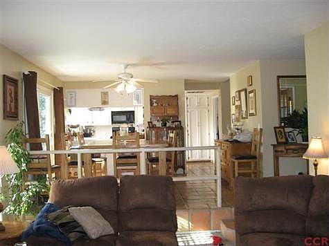 Taken from the living room looking towards dining room/kitchen.