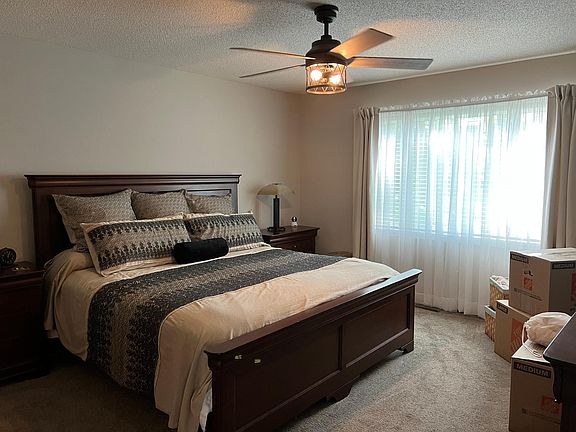 Large Main Level Master Bedroom with Walk-in Closet. Views of the beautiful pond area.