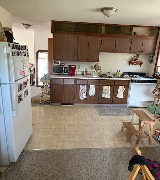 Look at the LARGE kitchen off the living room with an open concept design for dining. Great for home cooked meals!