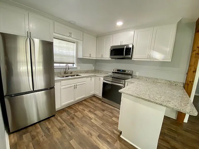 Newly remodeled kitchen, cabinets, granite counter tops with new appliances.