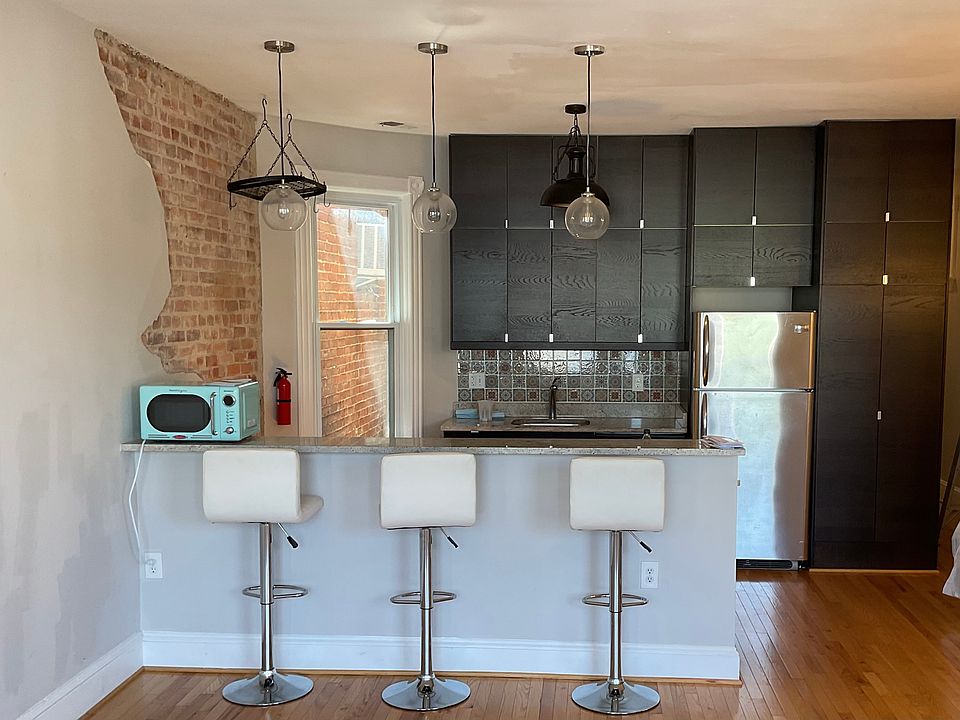 Kitchen with sitting bar space.