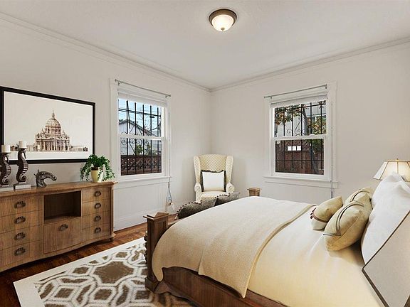 Second bedroom with great light and closet. 

(Furniture added digitally)