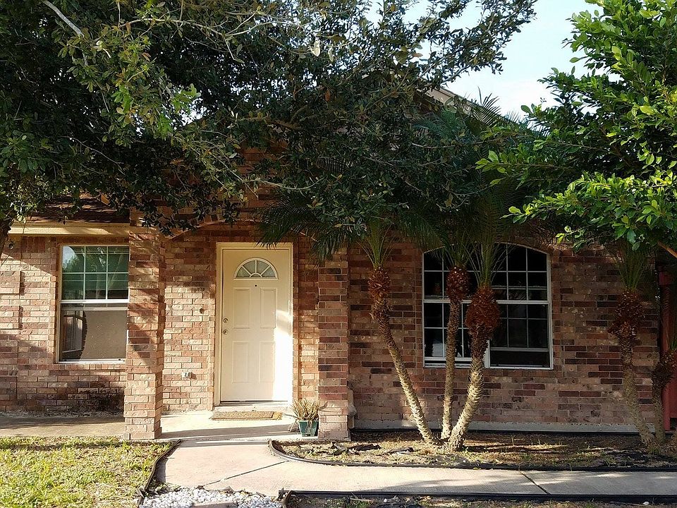 Our cute, red-brick house with spacious front yard
