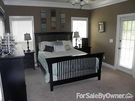 Master Bedroom
						:
						Plenty of room with sitting area and door to private porch.