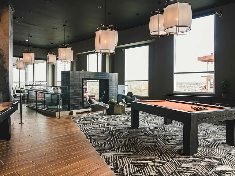 Spacious rooftop deck with expansive river views, featuring billiards and shuffleboard for your enjoyment.