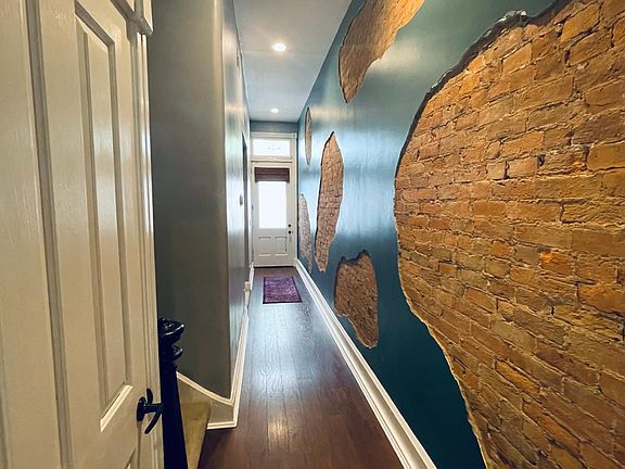 Gorgeous exposed brick in the hallway!