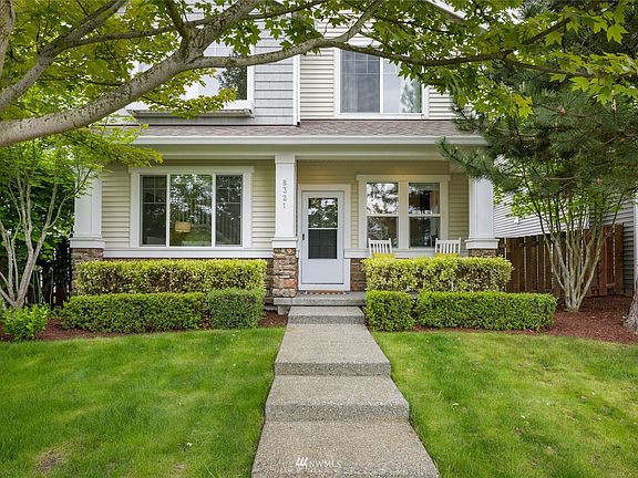 Covered front porch entry to greet your guests and to enjoy sunset skyline & territorial views