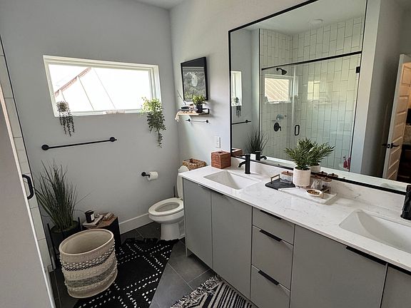 Two sink bathroom with stand up shower