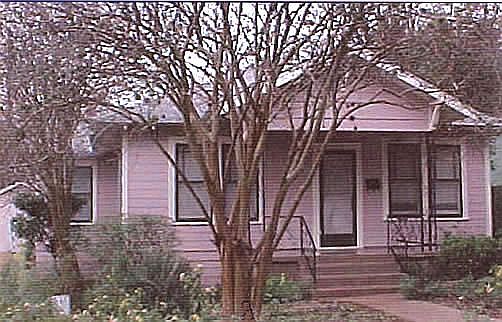 flower-filled front yard on quiet street