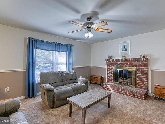 Living room , top of stairs w/ ceiling fan & light
