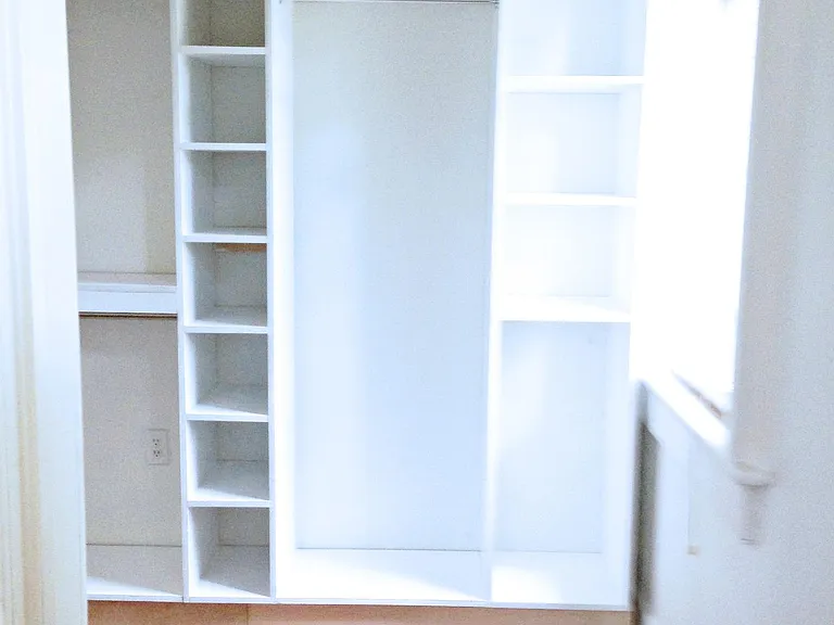 Walk-in closet that leads to bathroom