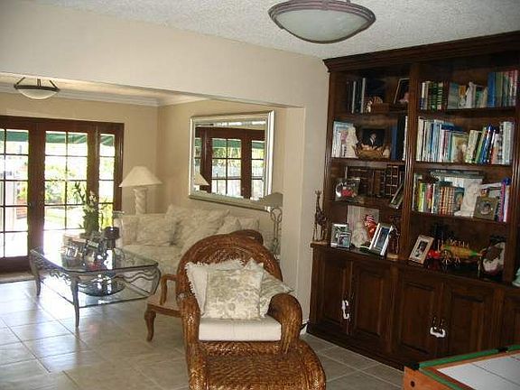 Library and Family Room beyond with 3 sets of French Doors