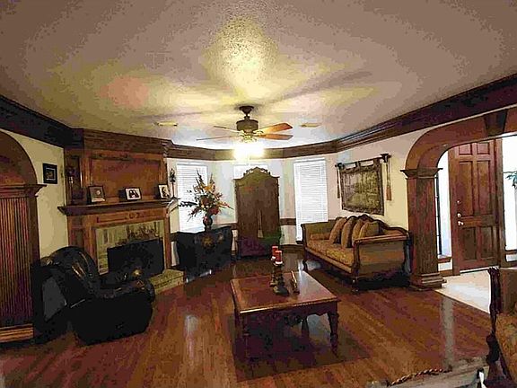 Warm and inviting den with gas log fireplace.