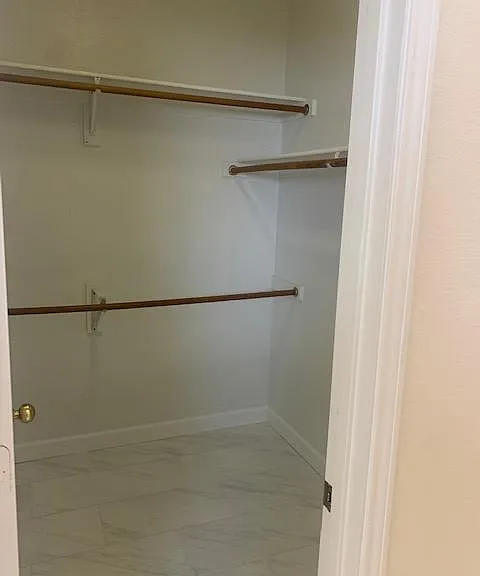 Updated tile flooring in master closet and master bath