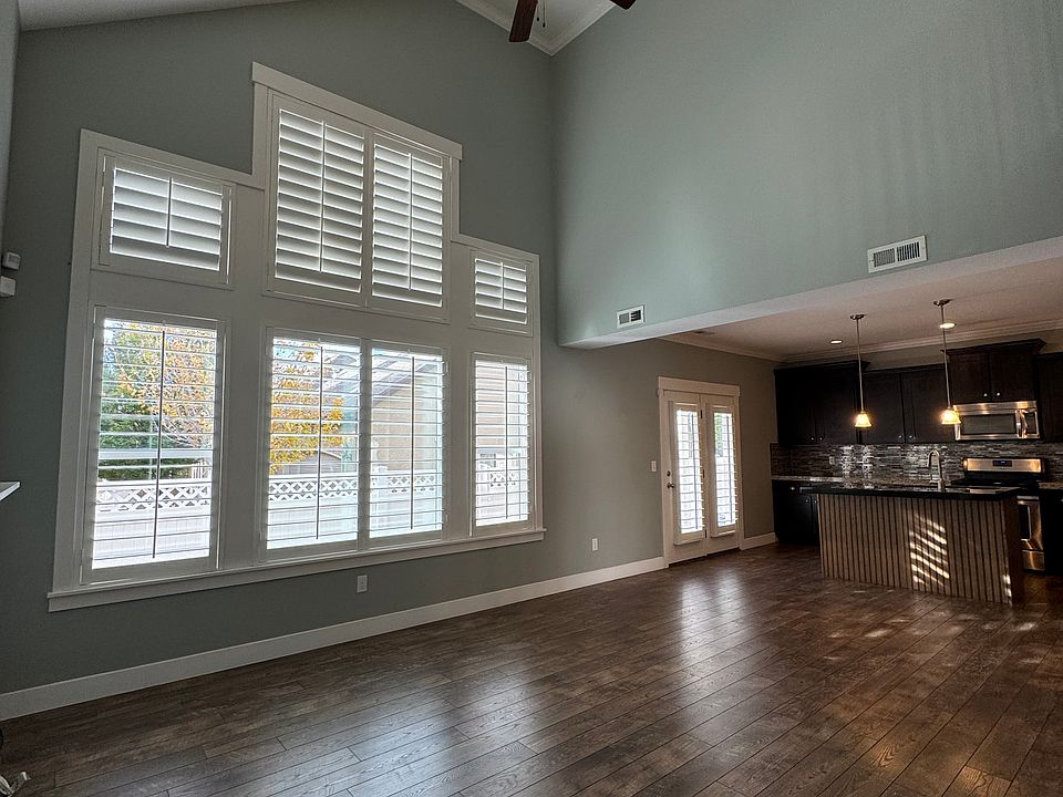 Living room, big windows with lots of natural light.