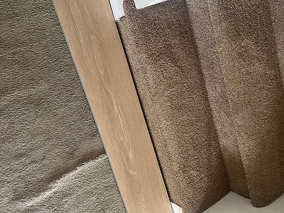 New LVP flooring to be installed in the living, dining, kitchen and lower level family room!