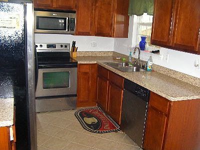 Kitchen, Stainless Steel appliances, maple cabinets, eating area