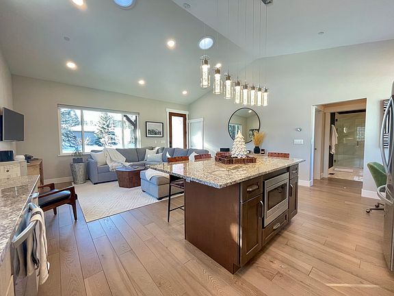 Hardwood floors throughout, granite counter tops, and solid wood cabinets with plenty of storage