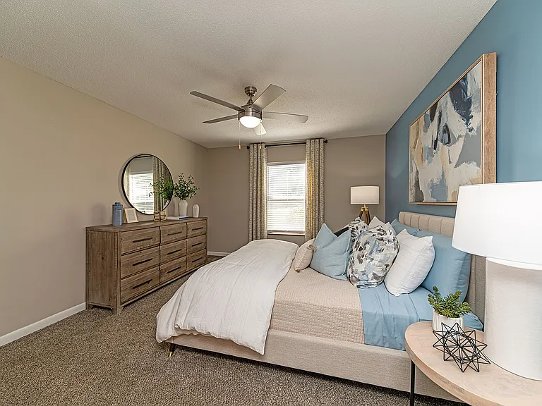 Cozy bedroom with carpet and ceiling fan