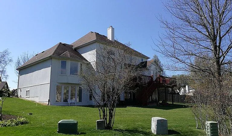 back yard view, you can see closed windows of basement and ones of master bed room.