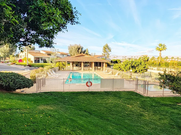 Pool and clubhouse just steps away with spa. Community features two additional pools as well.
