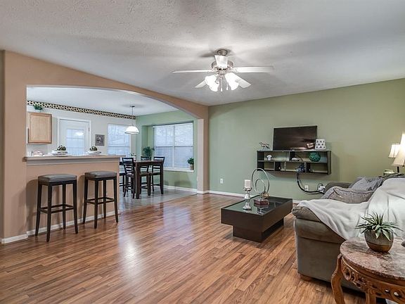 Large living room and entryway into the kitchen.