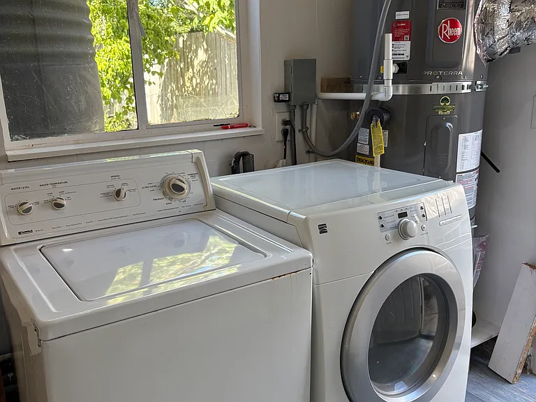 Laundry room with washer, dryer, brand new hybrid electric water heater