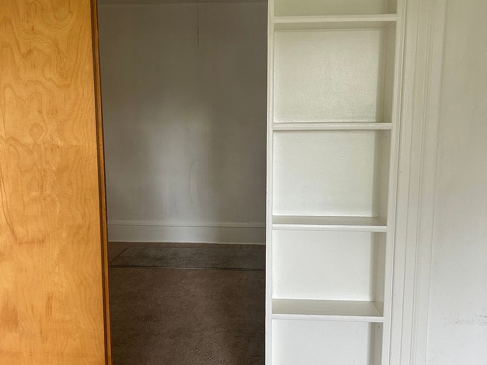Sliding door to close off bedroom of the living space. Loving room has built in shelves