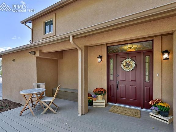 Partially covered front porch with a composite deck