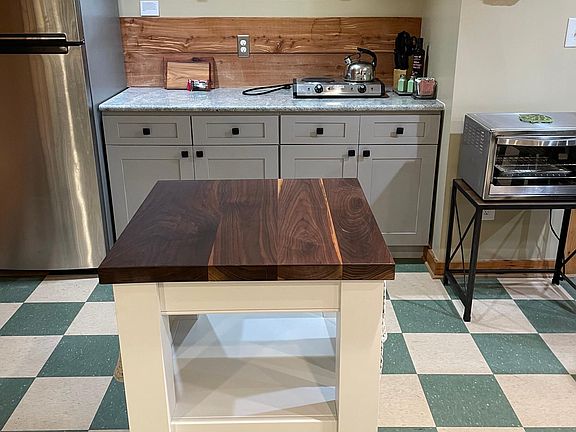 Fully equipped kitchen with gorgeous walnut butcher block island.