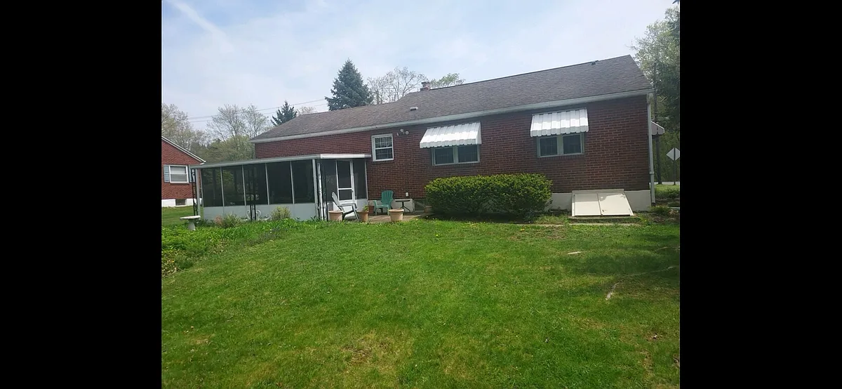 Rear view with 3 seasons screened room - 327 S Main Rd