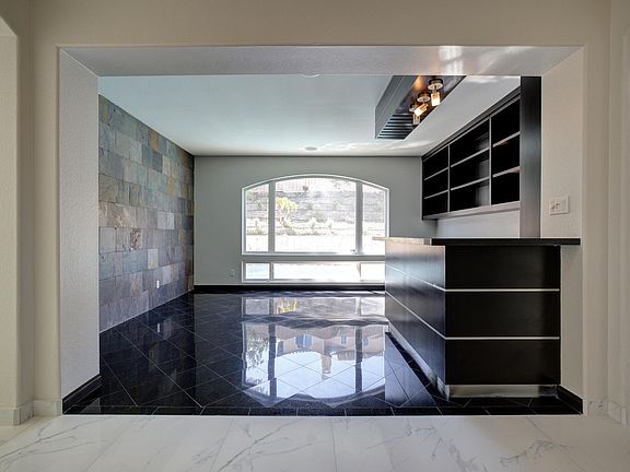 Formal living room with wall to wall bar