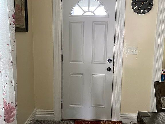 Front door. New carpet. 