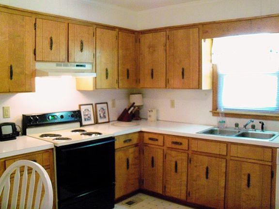 The kitchen has an abundance of cabinet space.