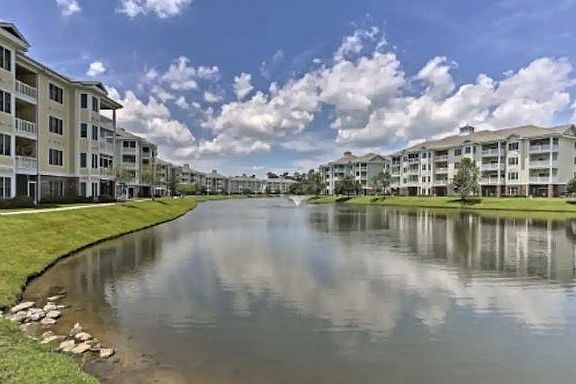 Unit overlooks a walking path and large pond