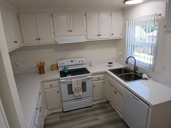 Above the kitchen, kitchen window looking out onto the green belt, large space for your refrigerator, extra lighting and bright sunlight during the day.