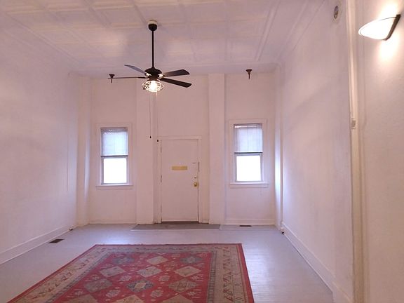 Big Storefront Living Room with new ceiling fan looking east
