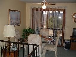 dining area with sliders to deck, overlooking the golf course